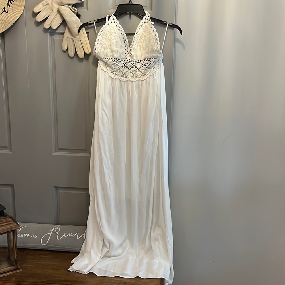 Lined white crochet sundress. Worn once on a cruise. Sexy and beautiful.…